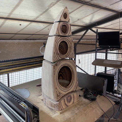 Bare plywood Large Speaker cabinet on the CNC bed, showing all four driver recesses