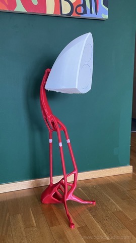 White Small Speaker cabinet mounted on a red sculptural cast stand